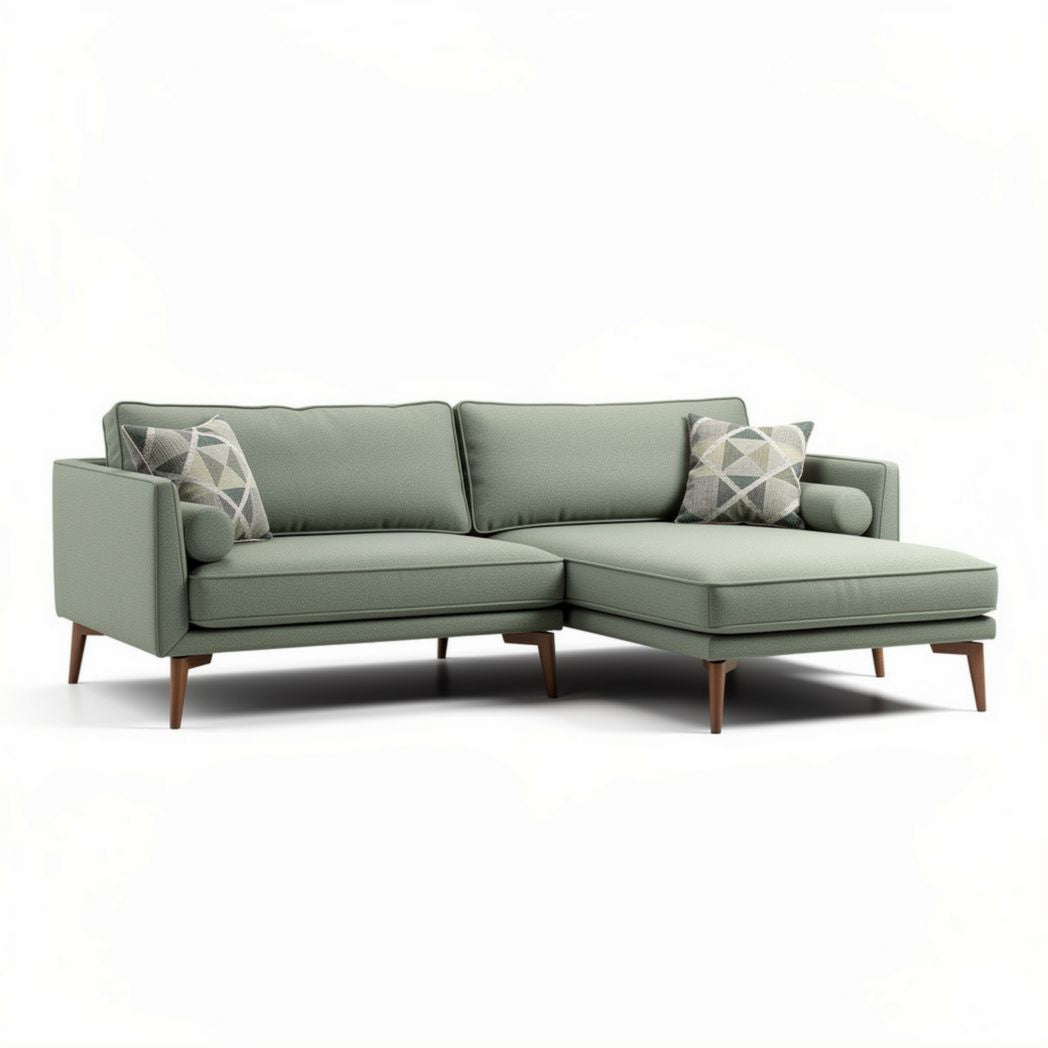 Mid-century modern sectional sofa in light green fabric with two accent pillows